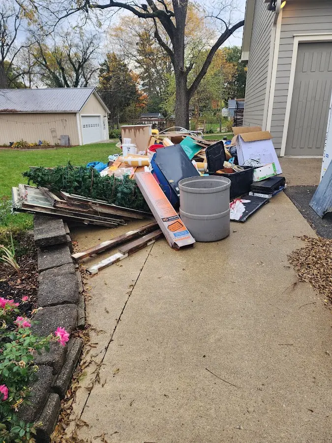 Dumpster being loaded with debris for 3 Yard Dumpster Rental in Whitehall